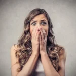 Showing More False Bashfulness and Confidence Crossword Clue